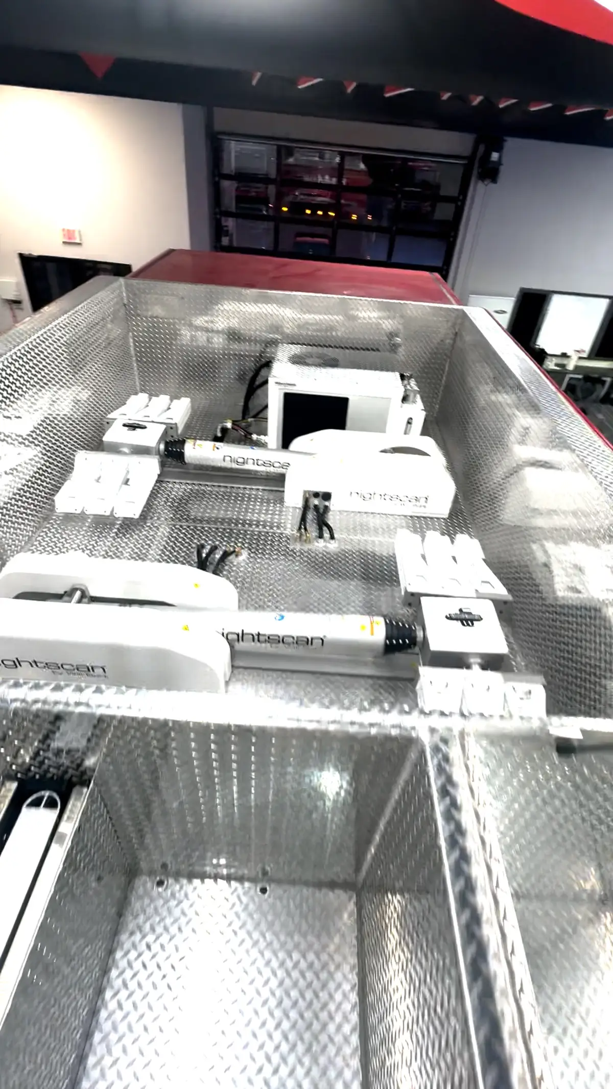 Top hosebed view showing diamond-plate deck and hosebed divider layout