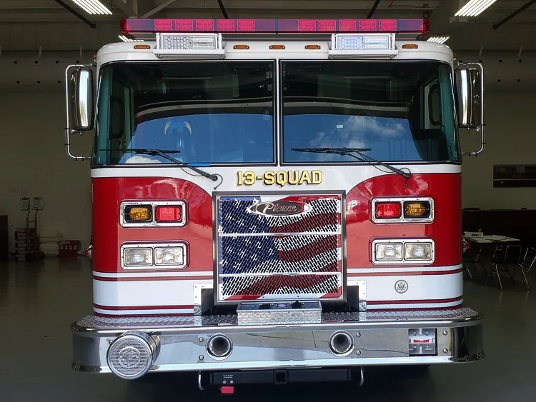 Head-on front view showing grille, windshield, warning lights, and front bumper intake ports.