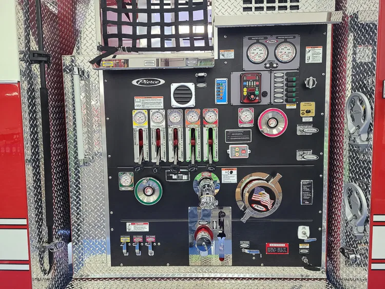 Pump panel close-up showing gauges, valves, and intake controls