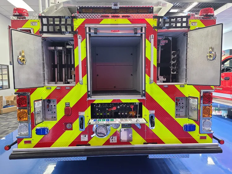 Rear view with open center compartment showing rear storage bay