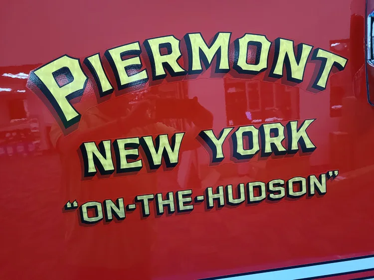 Body side lettering close-up on red panel