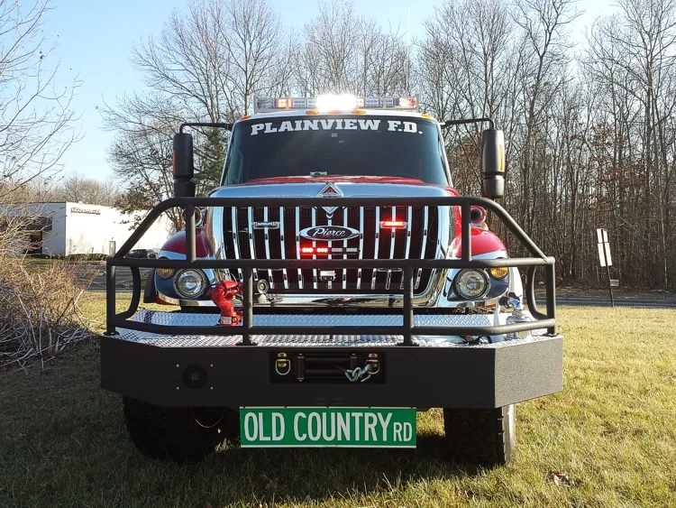 Front exterior view showing grille guard, bumper, and warning lights