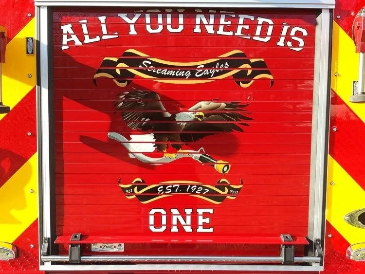 Rear roll-up door close-up with chevron border and center panel graphics