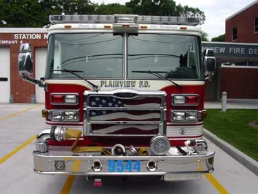 Front exterior view showing grille, bumper, and warning lights