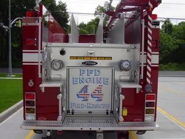 Rear view showing rear panel, warning lights, and hosebed divider fins