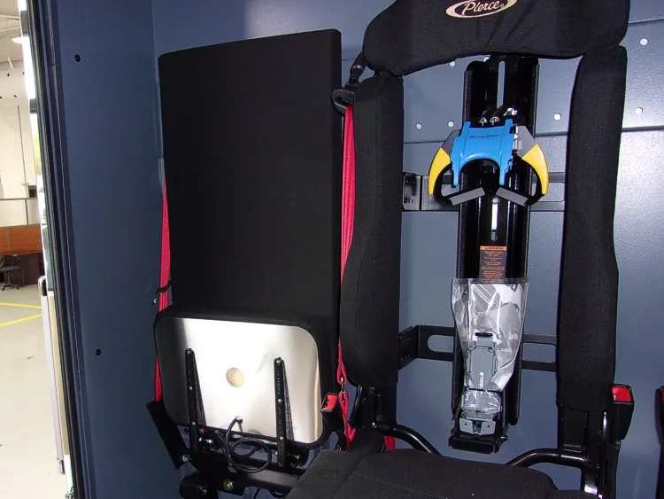 Open rear seating compartment showing mounted SCBA seat and side compartment