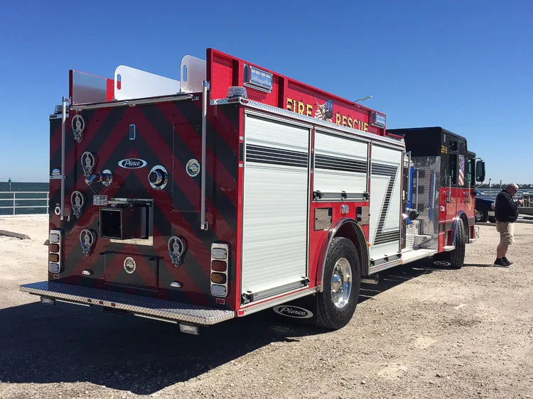 Rear-left exterior view showing rear body and side panel graphics