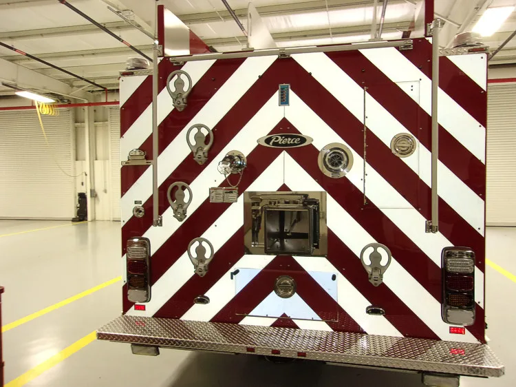 Rear view showing red-and-white chevrons and center rear badge panel