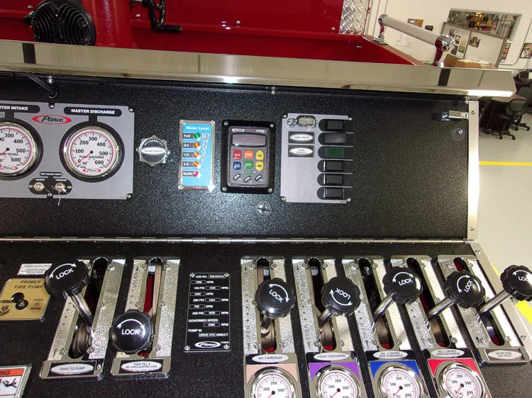 Open drawer close-up showing arranged hand tools and pressure gauges