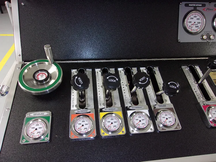 Open drawer close-up showing nozzles, adapters, and equipment fittings