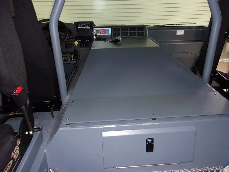 Open rear storage bay view showing flat slide-out cargo tray