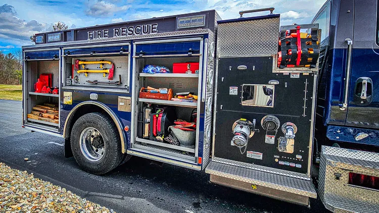 Driver-side profile with compartments open showing pump controls and shelf layout