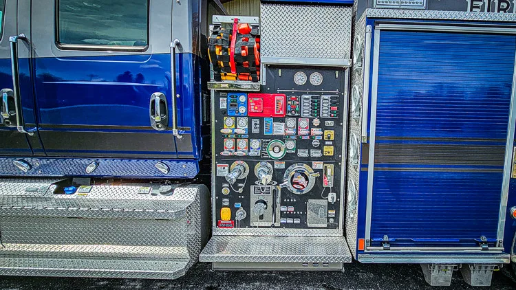 Pump-side control panel close-up showing gauges, valves, and intake hardware