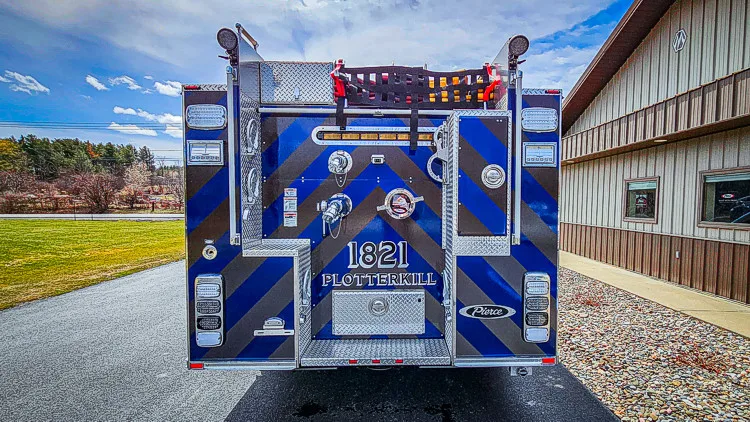 Rear view showing blue-and-white chevrons and center rear panel