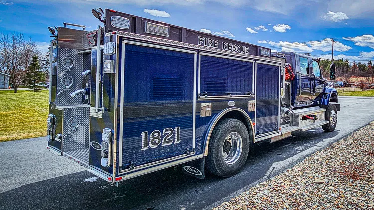 Rear-right exterior view showing side body and rear chevron section