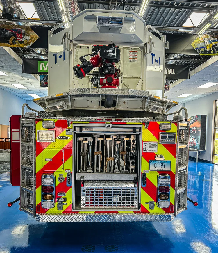 Rear view showing chevrons, rear lights, and ladder base assembly
