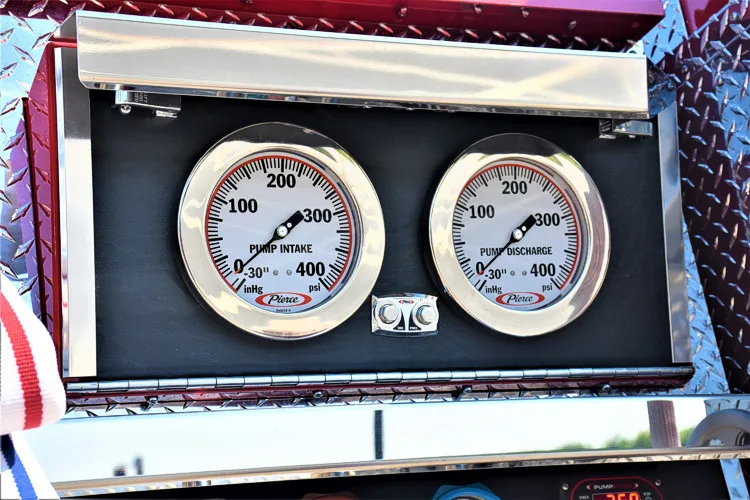 Gauge close-up showing dual pressure gauges in a framed panel