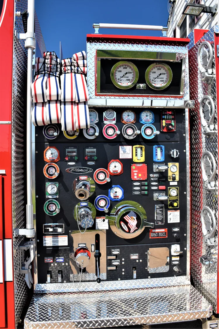 Pump panel close-up showing gauges, valves, and control levers