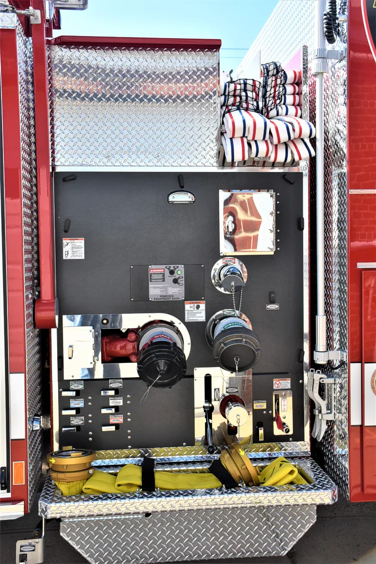 Open side compartment showing control module area and warning label panel