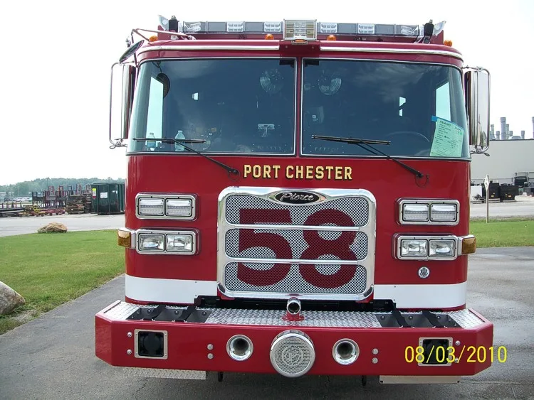 Head-on front view showing grille, windshield, warning lights, and front bumper intake ports.