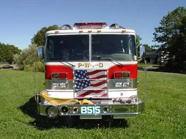 Front exterior view showing grille, bumper, and warning lights
