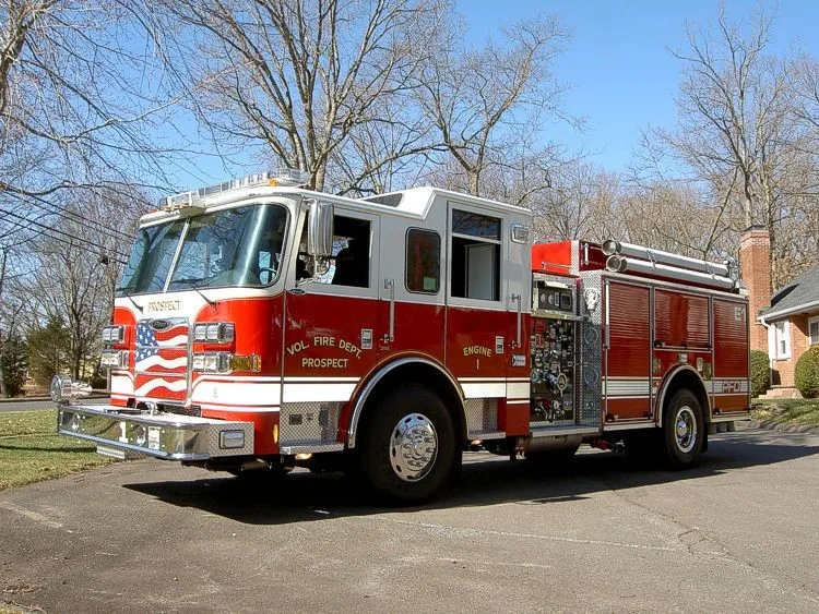 Front-right exterior view showing bumper, cab, and side body