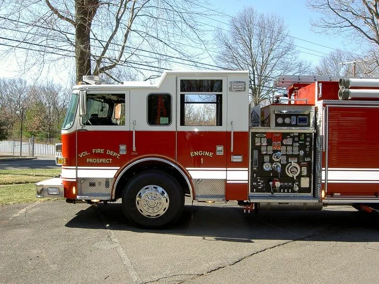 Driver-side profile with open pump panel showing gauges and valves