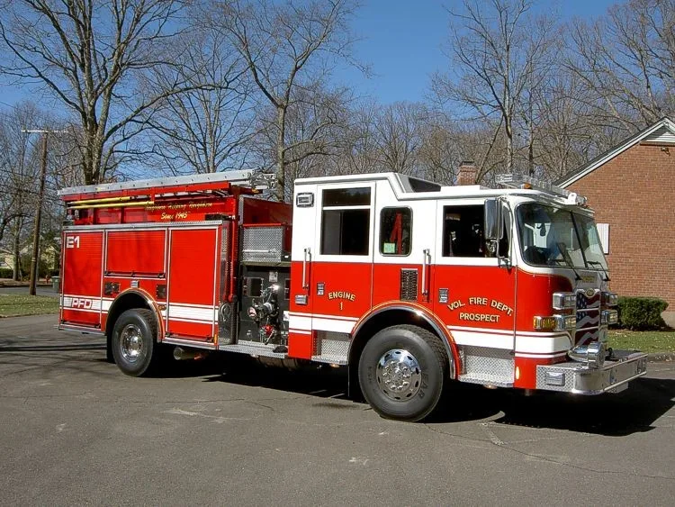 Driver-side full profile showing side compartments and wheel area