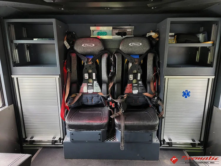 Rear crew interior view showing seat backs and aisle space