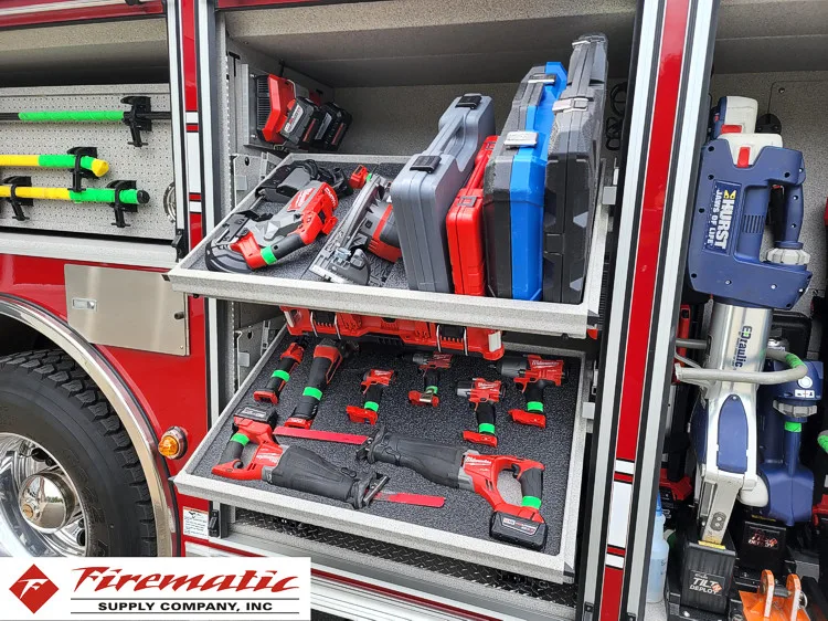 Open side compartment showing hand tools and rescue gear on shelves