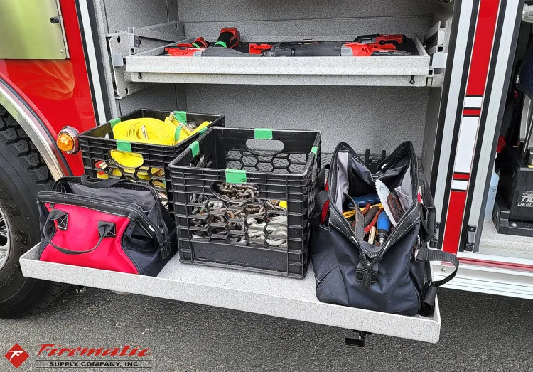 Open side compartment showing plastic bins and soft bags on pull-out tray