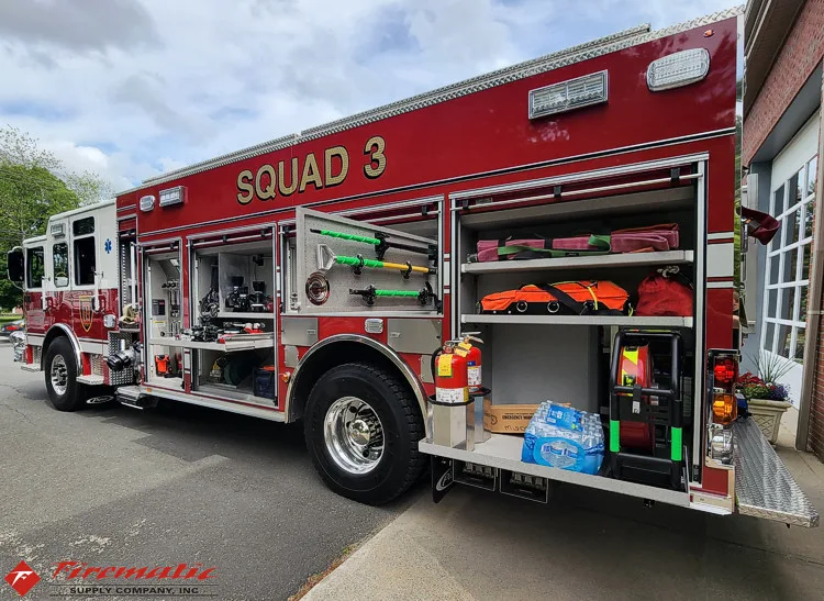 Driver-side profile with open compartments showing tools and shelf storage