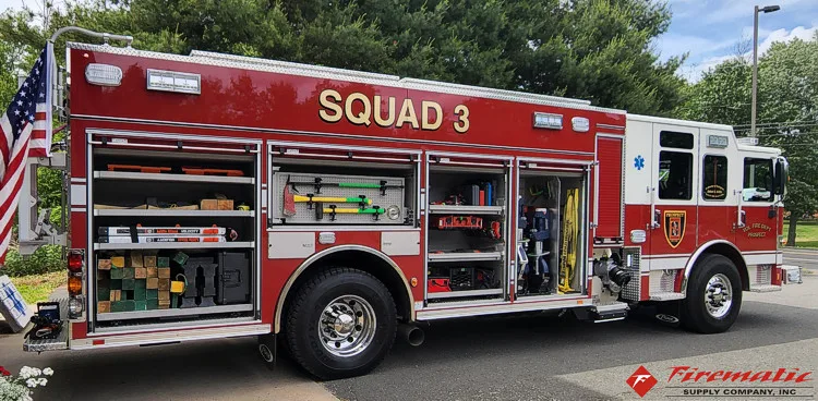 Driver-side profile with open compartments and wheel area visible