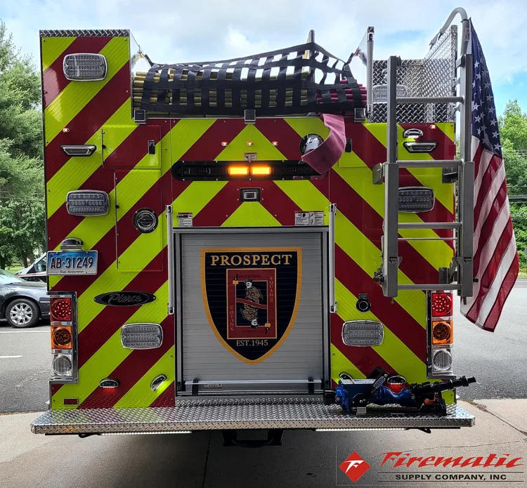Rear view showing red-and-yellow chevrons and center rear emblem