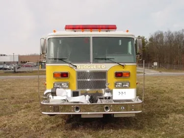Front exterior view showing grille, bumper-mounted intakes, and warning lights