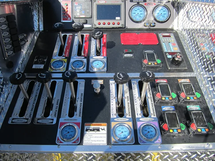 Control panel close-up showing rocker switches, indicator lights, and labels