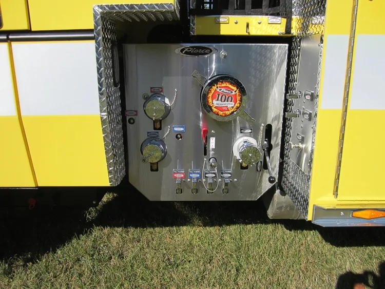 Pump-side control panel close-up showing gauges, valves, and intake ports