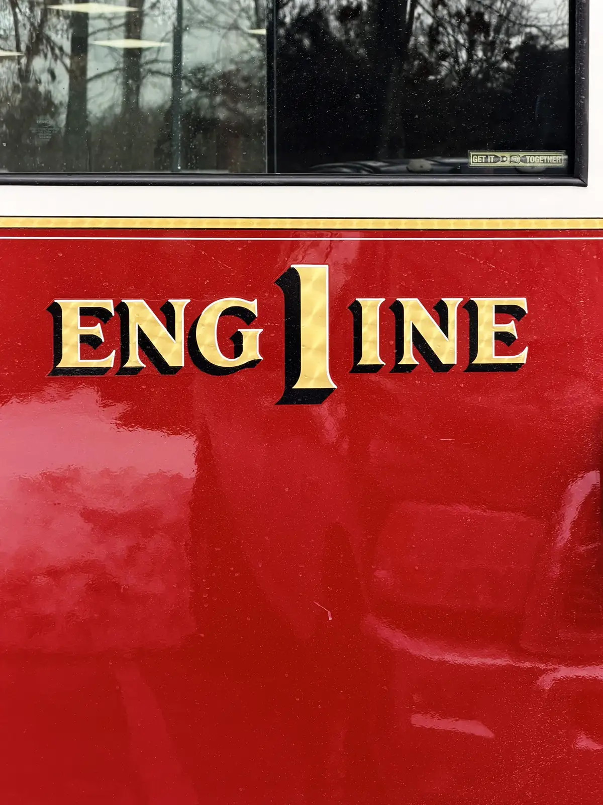 Rear-right exterior view showing side body and tandem wheel area