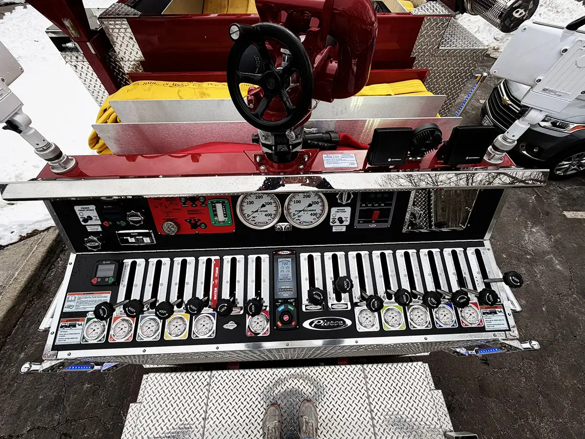 Deck-mounted nozzle close-up with yellow and red hose sections