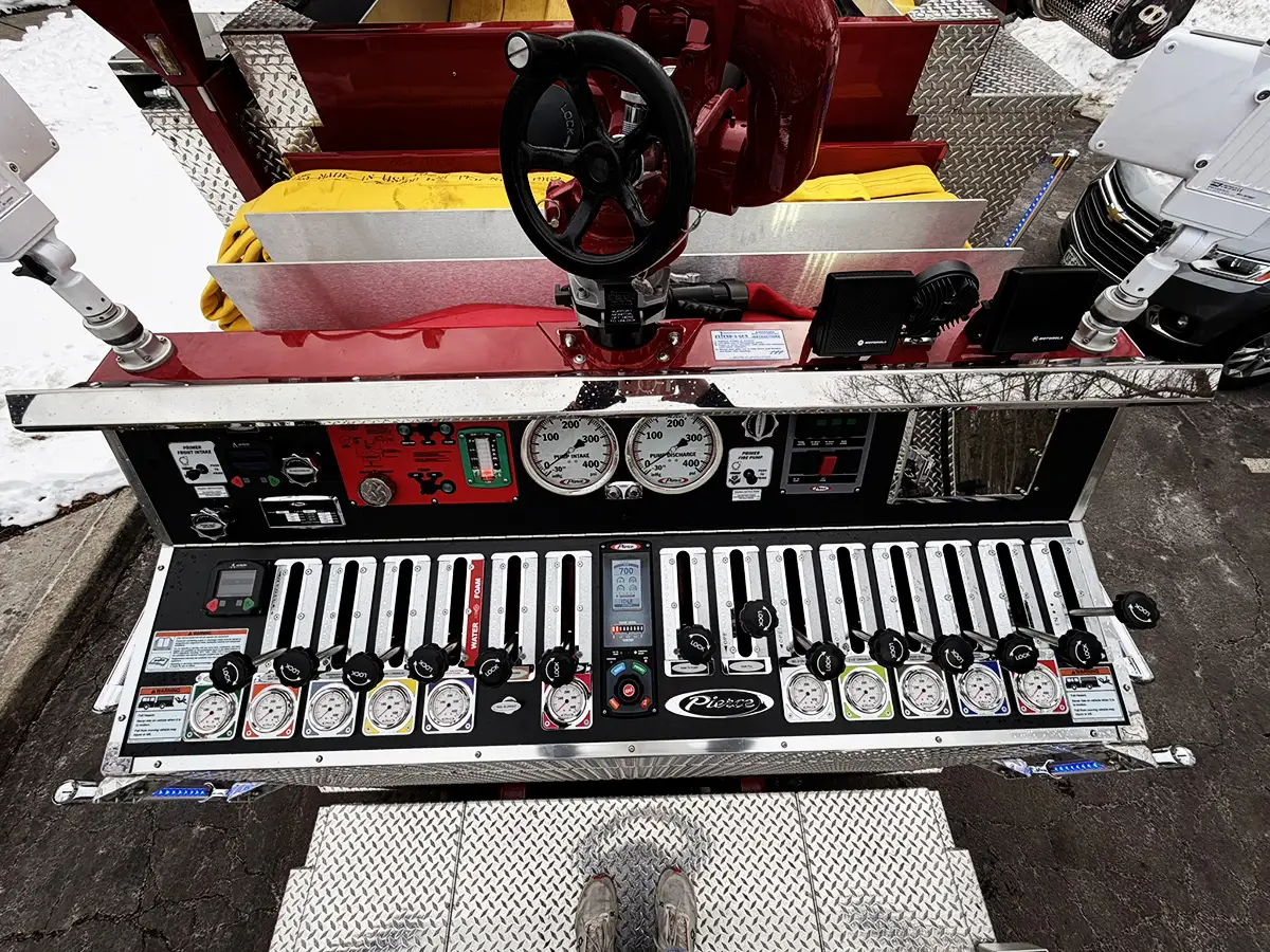 Rear control panel close-up showing intake valves, outlets, and metal deck
