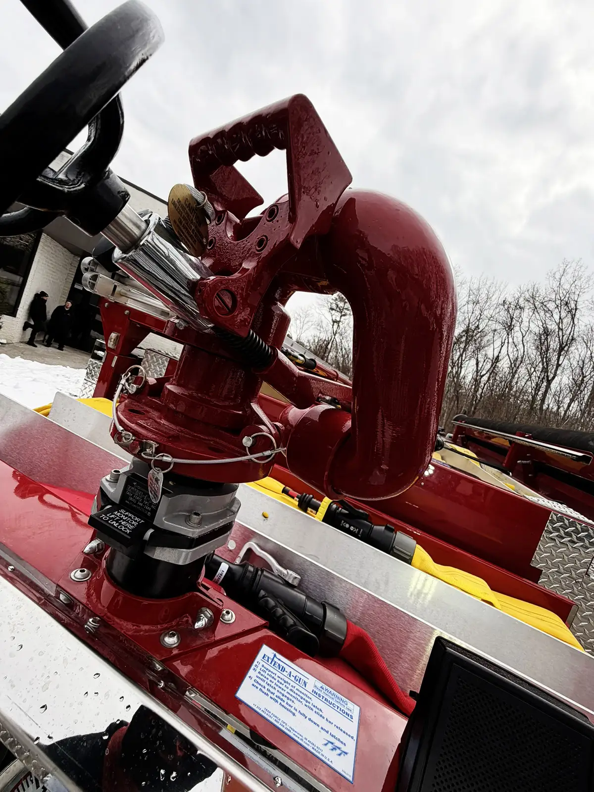 Rear control panel close-up showing gauges, valve labels, and warning placard
