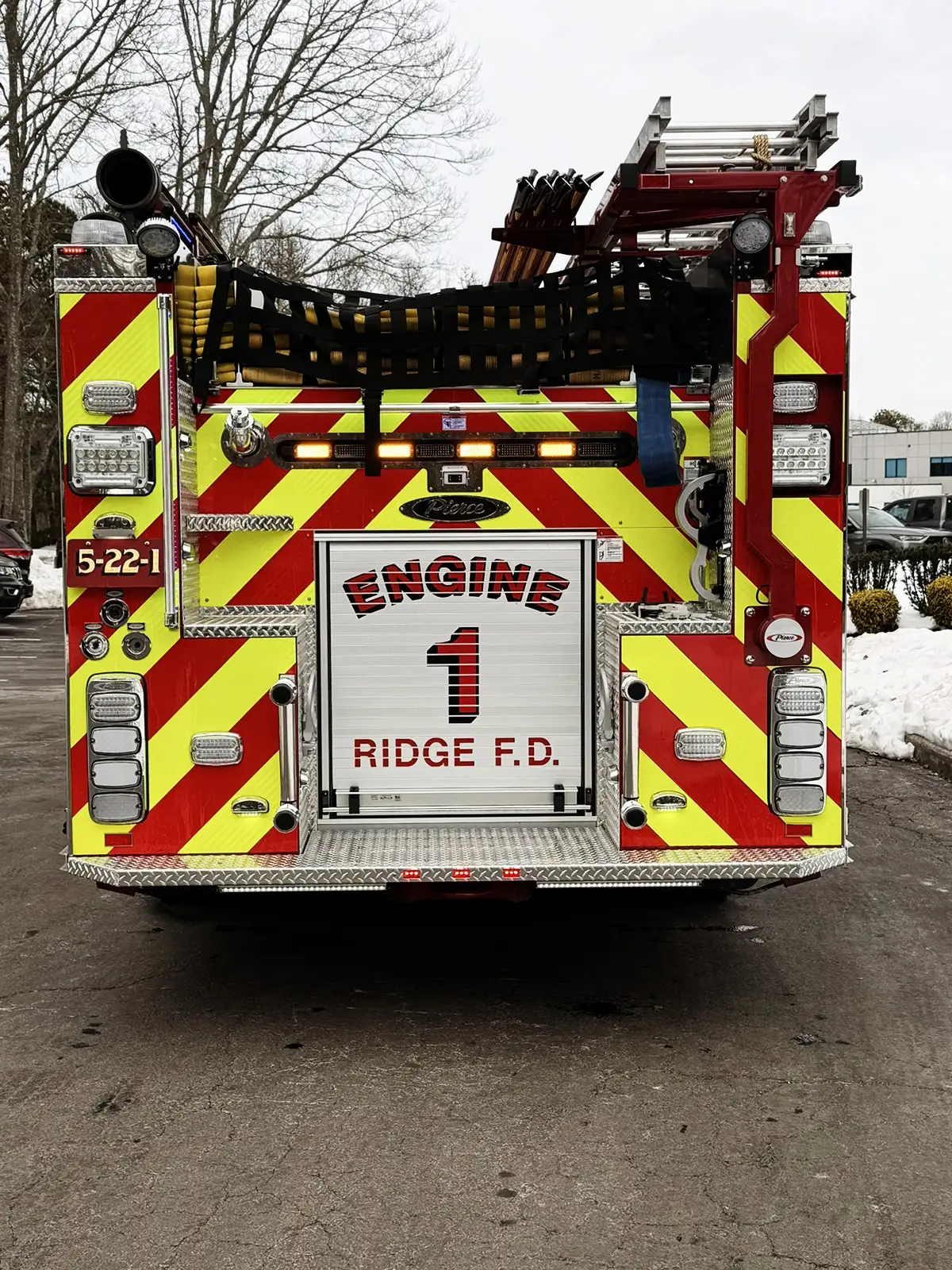 Rear view showing chevrons and open rear equipment compartment