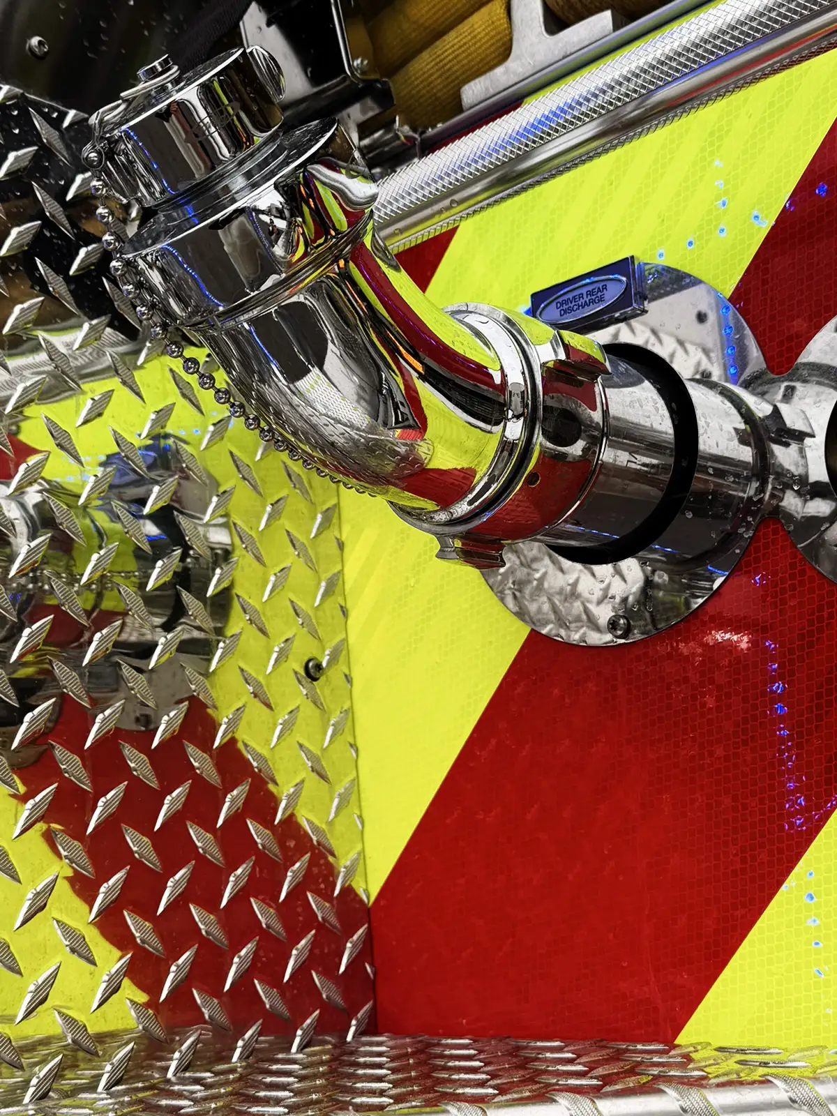 Front bumper corner close-up showing tow eye and cable fitting