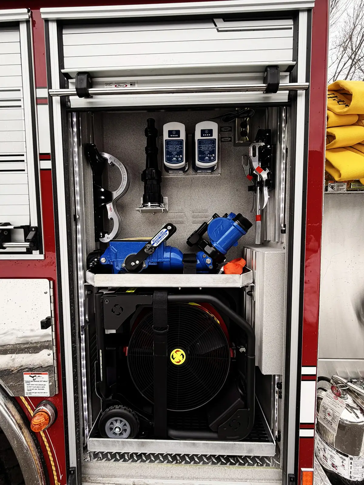 Rear body corner close-up showing side panel and reflective stripe