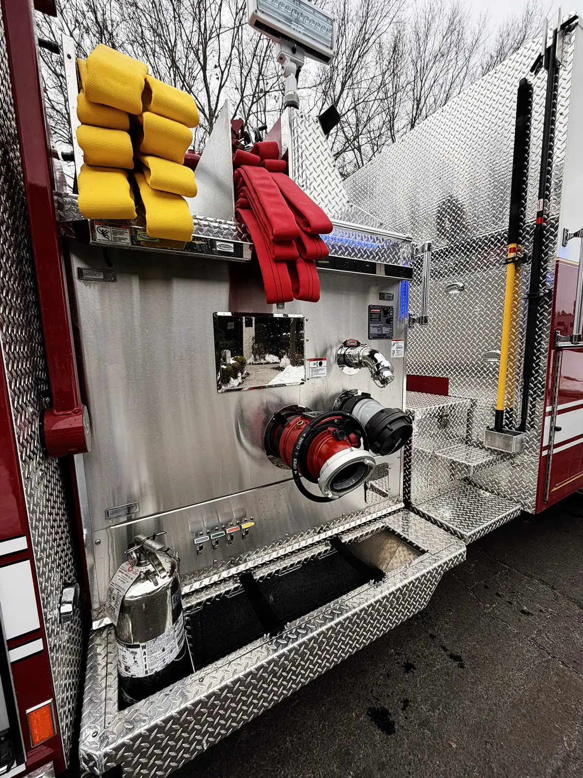 Rear intake panel view showing large intake connections and hose bundles above