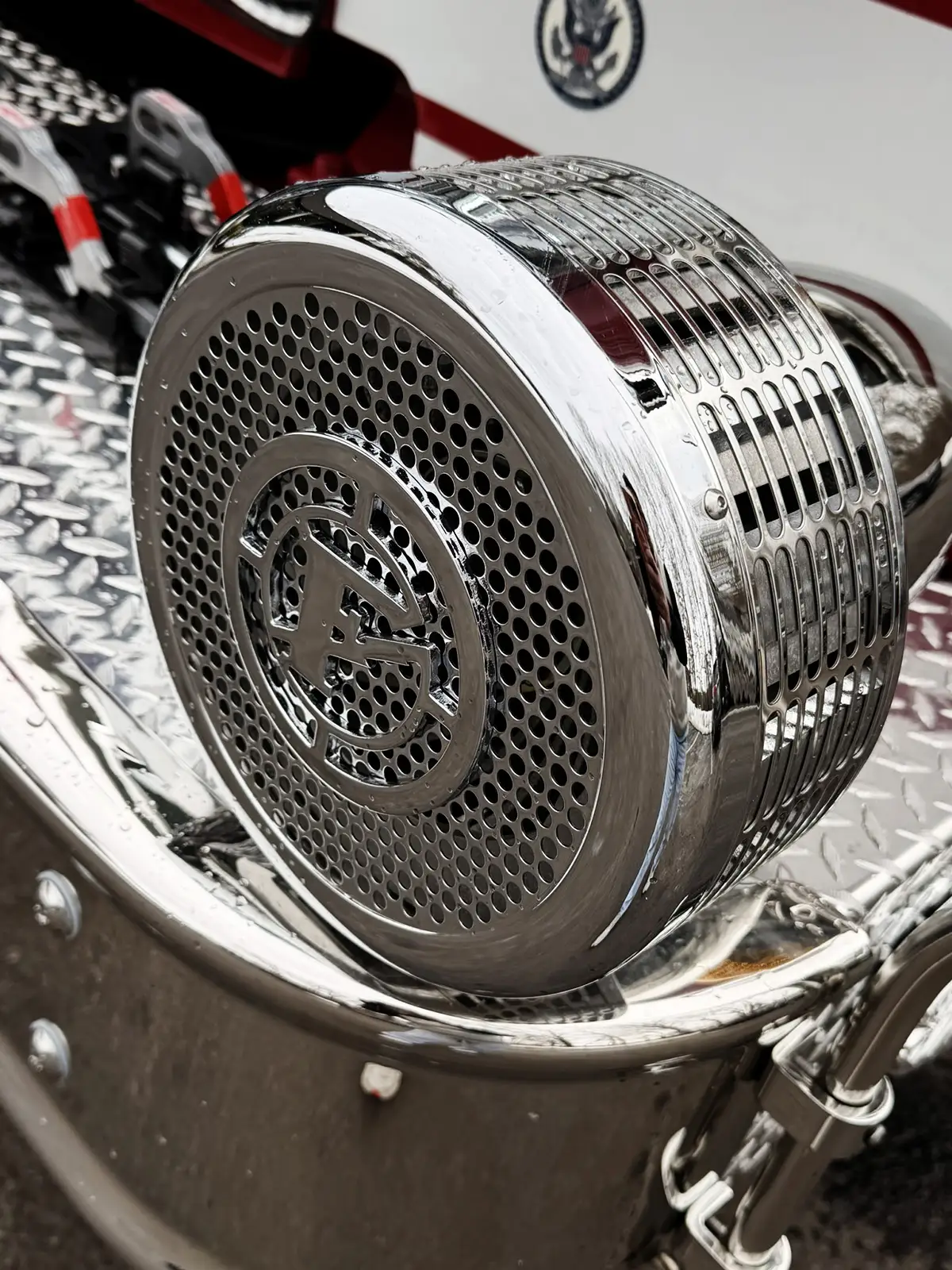 Round side marker light close-up on silver body panel