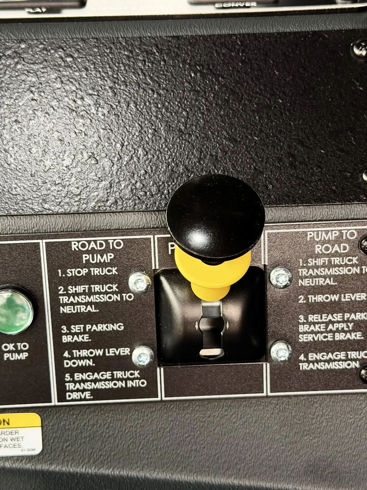 Cab ceiling area view showing overhead controls and handholds