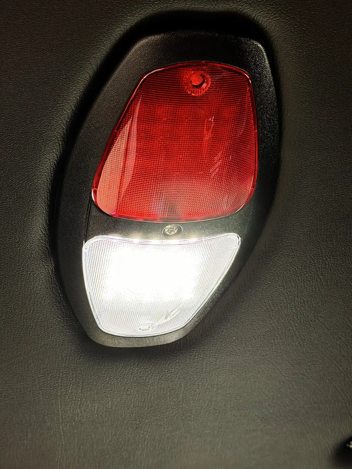 Open side compartment showing hydraulic tool power unit and accessories