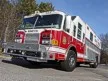 Heavy rescue truck front-left exterior view showing chrome grille and side body