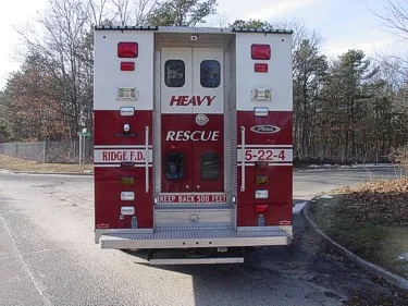 Rear view showing dual rear doors with chevrons and centered unit lettering